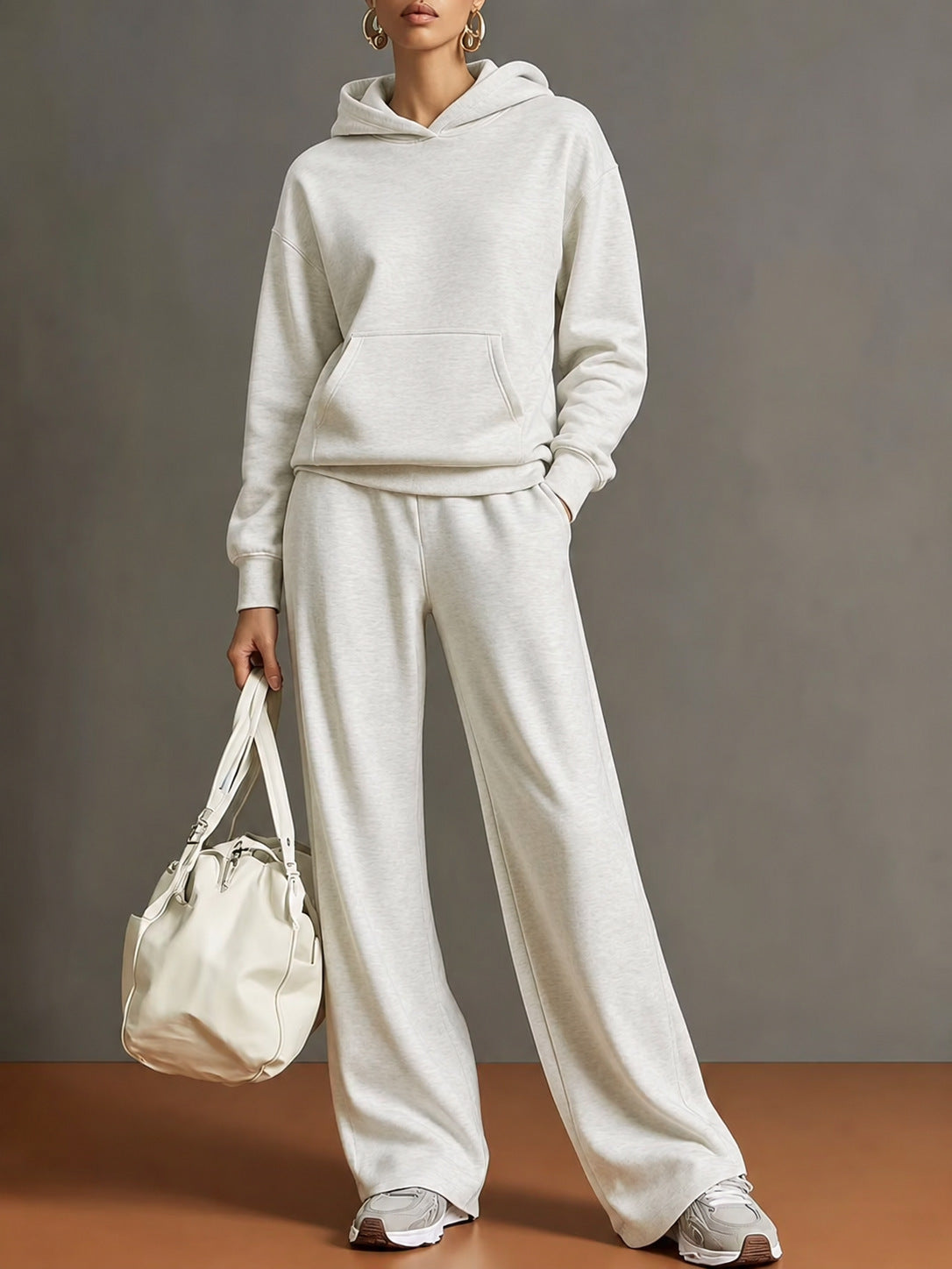 Women's hooded sweatshirt and wide-leg pants set, light gray, loose fit.