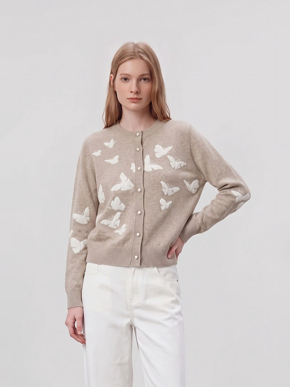 Women’s sand butterfly knit cardigan with long sleeves, ribbed cuffs, button placket