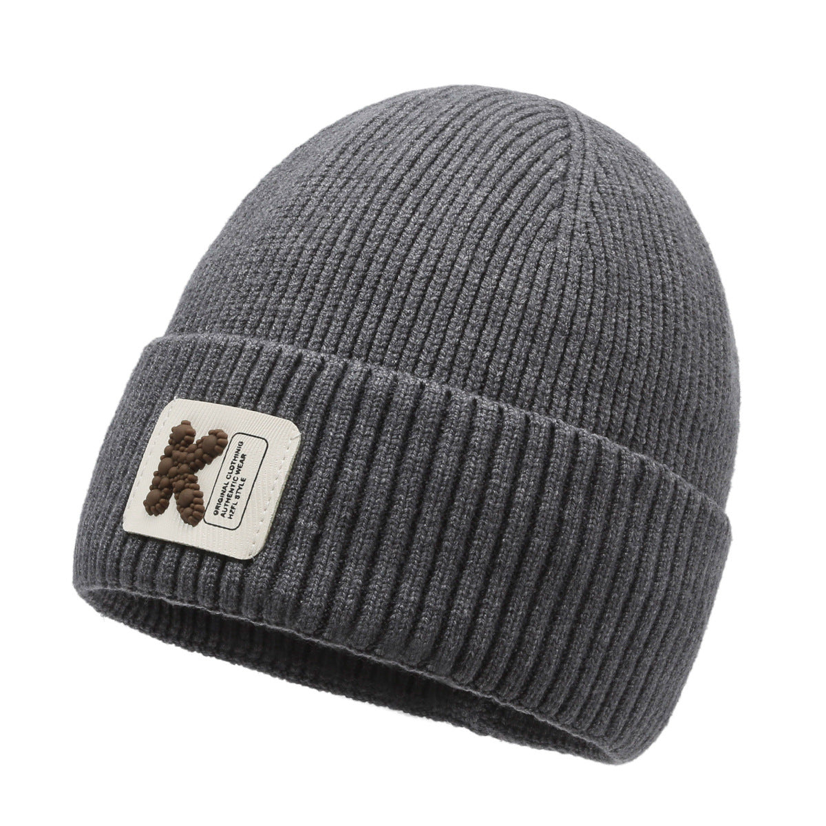 Gray rib-knit beanie hat with pom-pom style patch on cuff