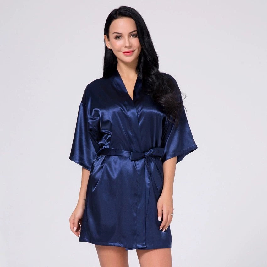 Navy satin short robe with V-neck and tied waist belt, short sleeves.