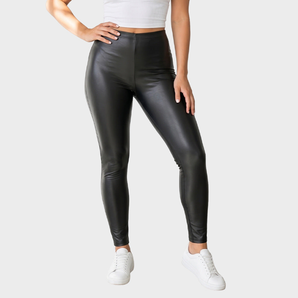 Black high-waisted faux leather leggings, seam lines, tapered skinny legs