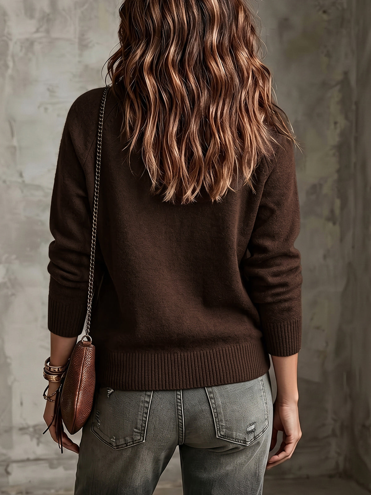 Brown knit V-neck button-front cardigan sweater with ribbed cuffs and dropped shoulders