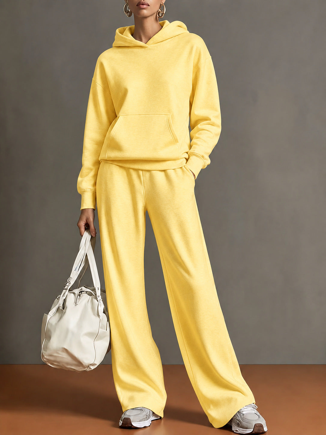 Women's hooded sweatshirt and wide-leg pants set, yellow, loose fit.