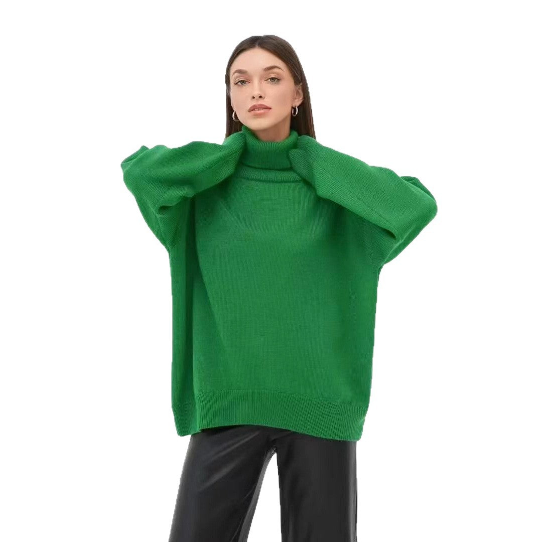 Oversized green turtleneck sweater with ribbed roll neck and wide elbow-length sleeves