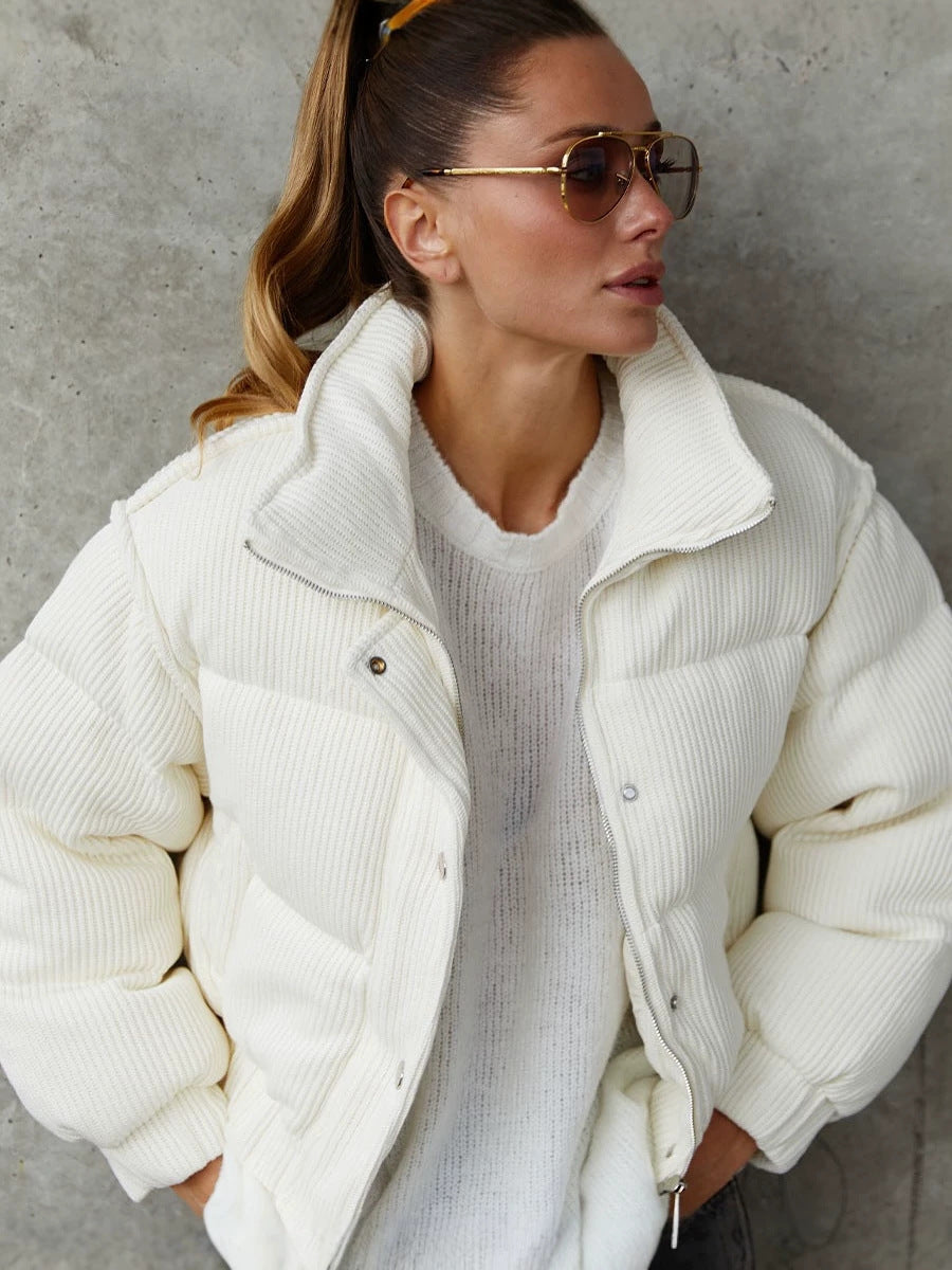 White quilted puffer jacket with stand collar and button front, long sleeves