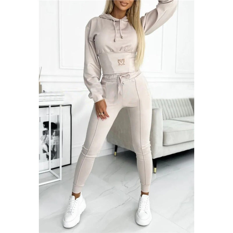 Light gray hooded top and long jogger pants set with drawstring waist and logo.