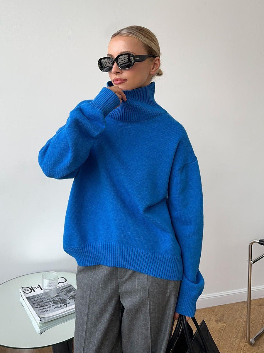 Loose turtleneck knit sweater in blue, ribbed turtleneck and cuffs, relaxed fit.