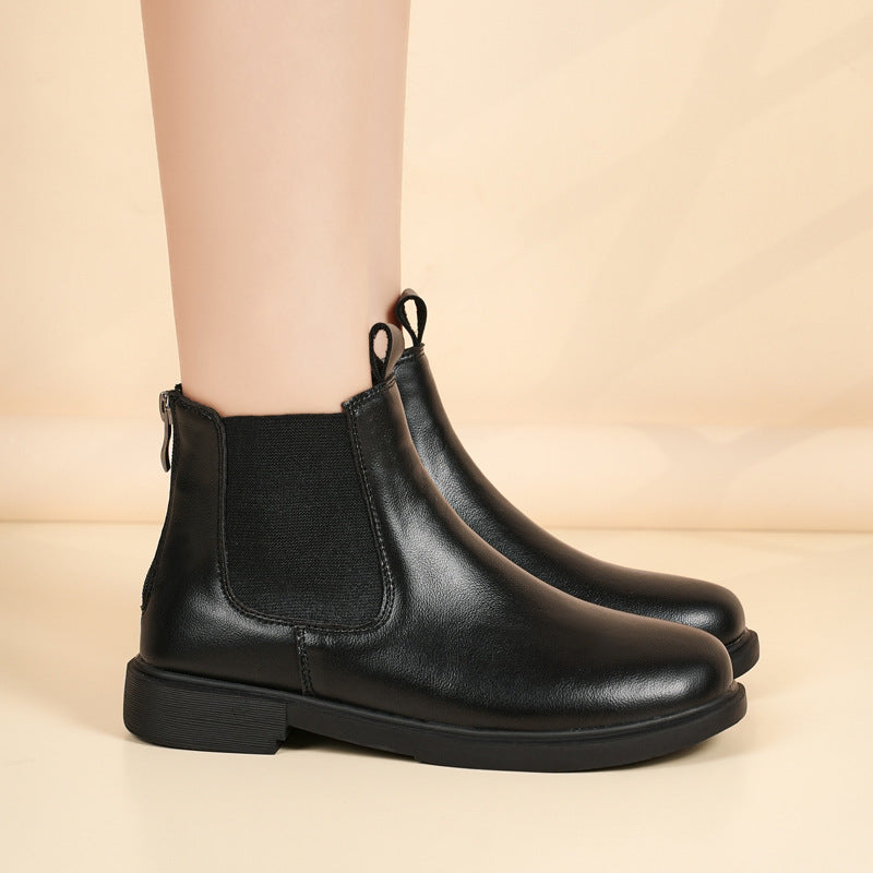 Black pull-on Chelsea boots with elastic gore and rounded toe