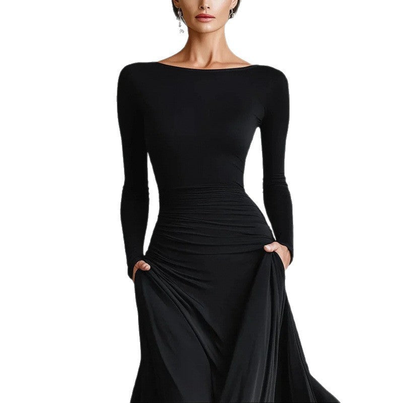 Black long-sleeve maxi dress with ruched waist and draped skirt overlay, upper-front view