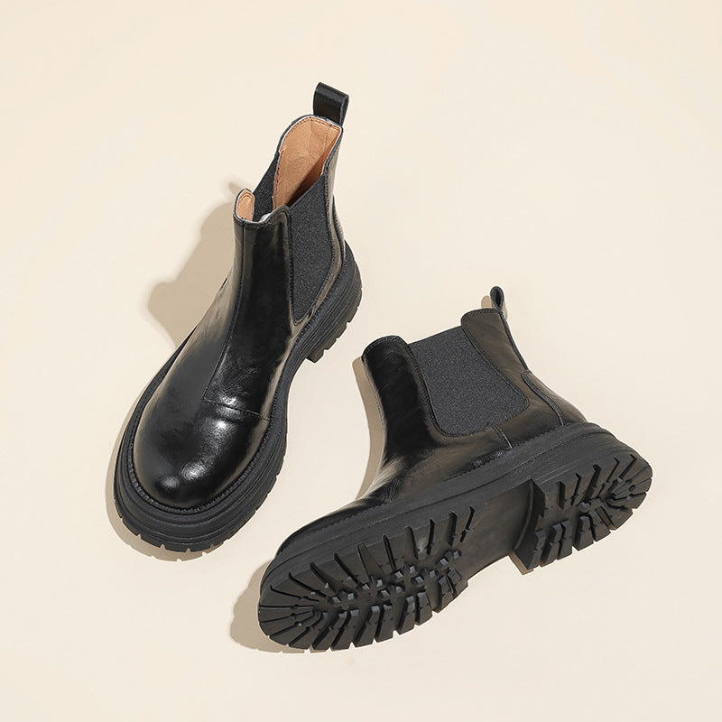 Black leather platform Chelsea boots with lug sole tread and chunky block heel