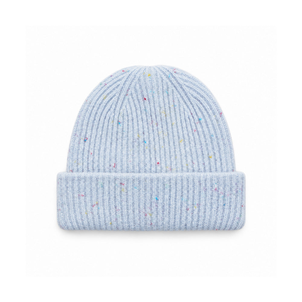 Blue speckled rib-knit beanie with a wide folded cuff, front view.