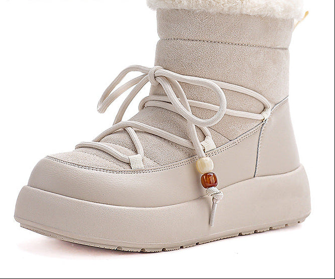 Light beige lace-up snow boots with thick sole and fuzzy cuff trim