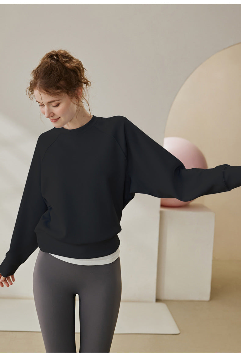 Black round-neck long-sleeve sweatshirt with loose fit and crew neckline