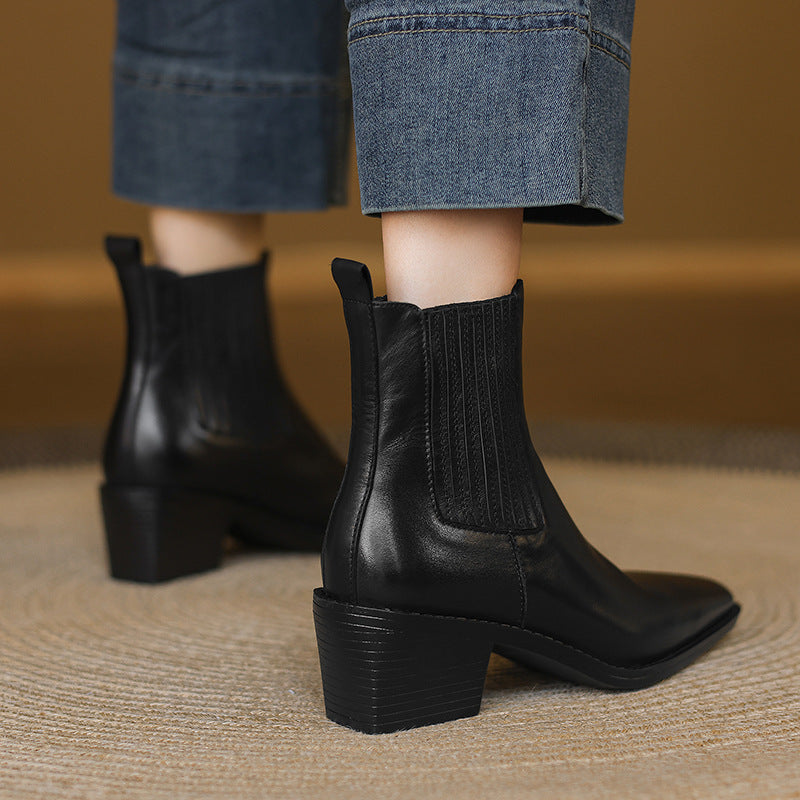 Black leather Chelsea boots with square toe and thick block heel, heel and gore detail
