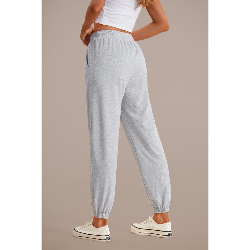 Grey high-waisted jogger sweatpants with drawstring and elastic ankle cuffs