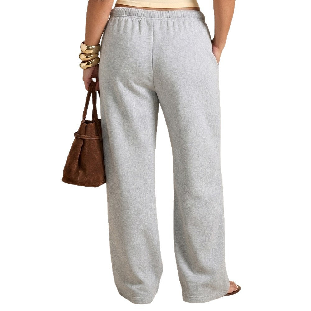 Grey relaxed fit wide-leg sweatpants with elastic waistband and drawstring, long straight legs
