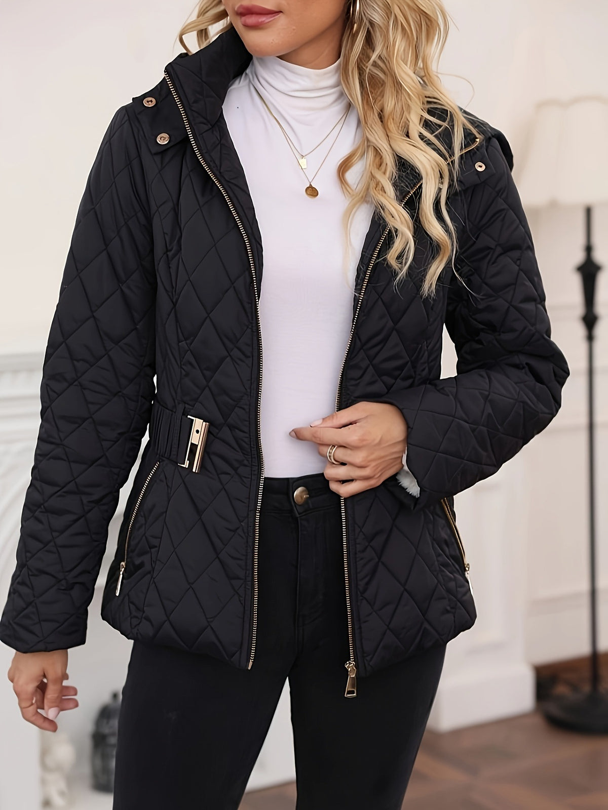 Black quilted hooded jacket with stand collar, zip front, snap buttons