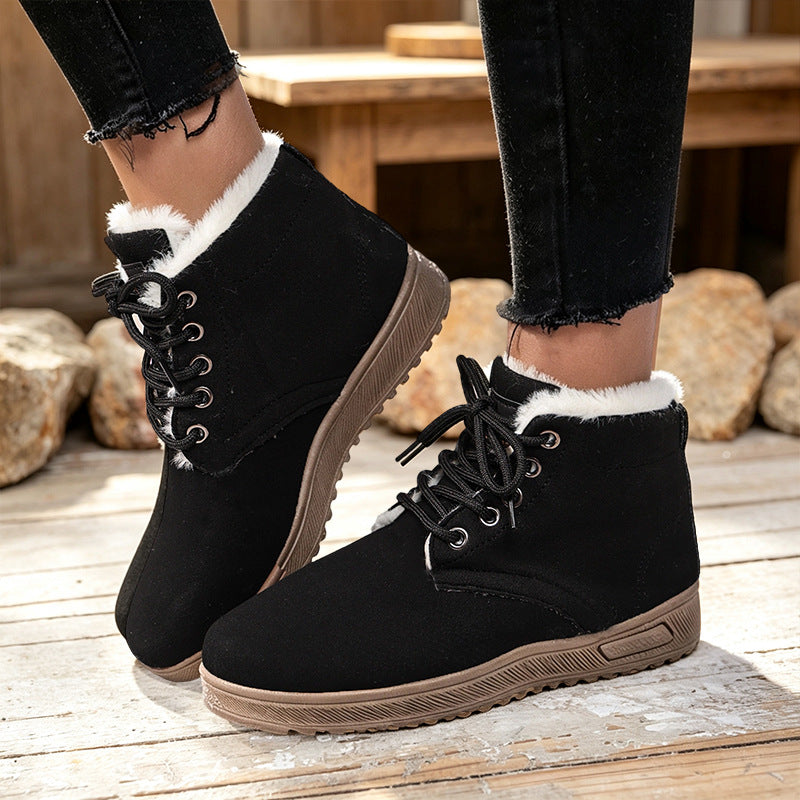 Black fleece-lined lace-up ankle boots with padded collars and brown textured soles.