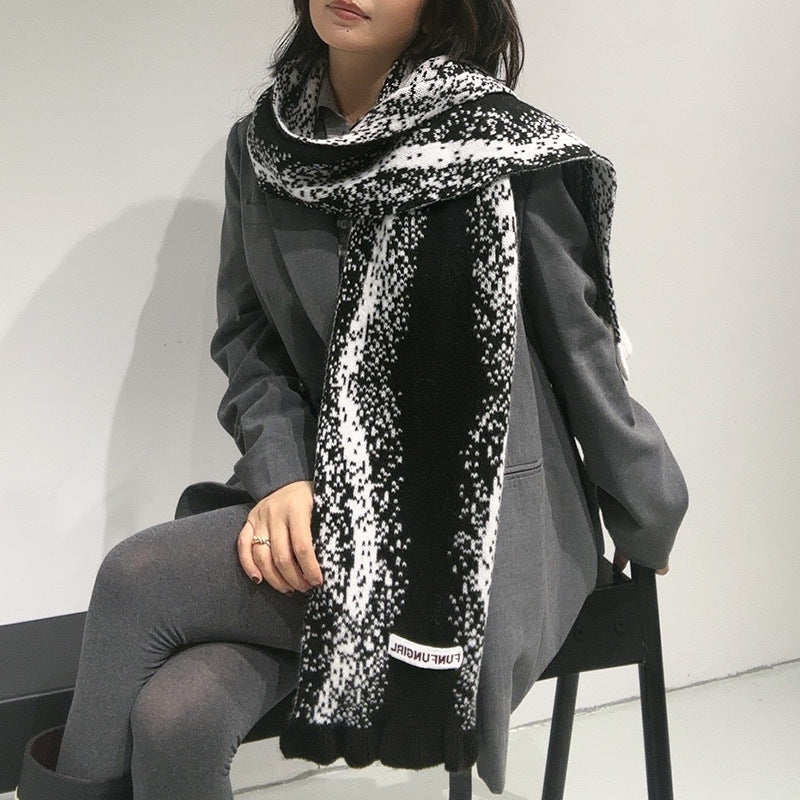 Women's knitted scarf with black-and-white speckle pattern and soft fringed edge