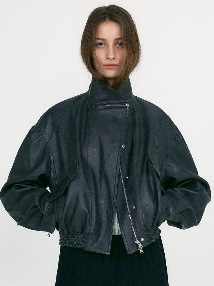Women's dark green leather jacket with stand collar, zip front, ribbed cuffs