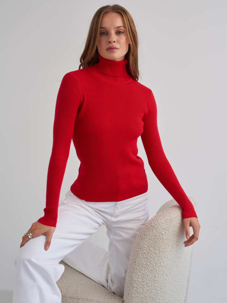 Red ribbed turtleneck sweater with fitted long sleeves