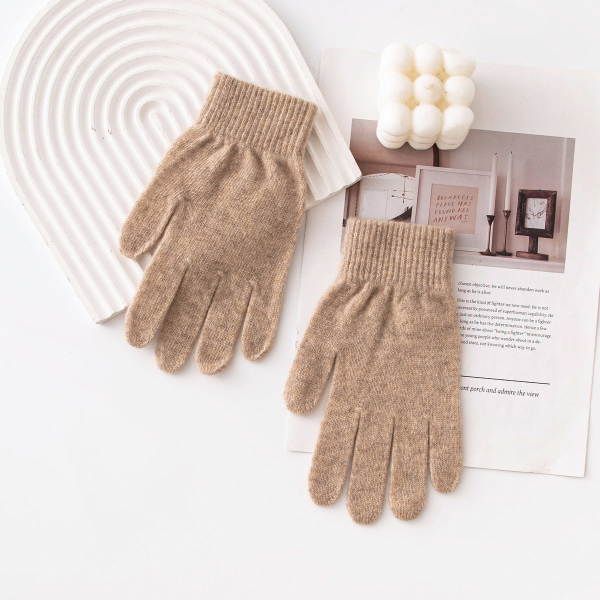 Pair of tan knitted gloves with ribbed cuffs and full-finger coverage.