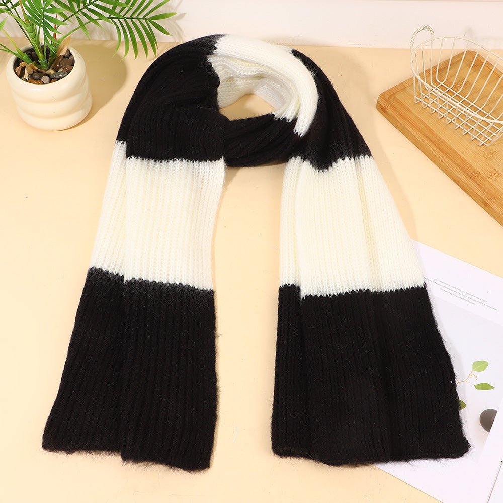 Black and white striped knit scarf, folded with ribbed texture