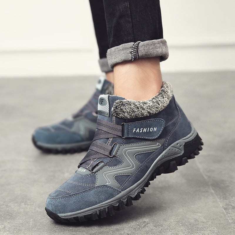 Blue-gray winter snow boots with faux fur collar, adjustable straps, and traction outsole