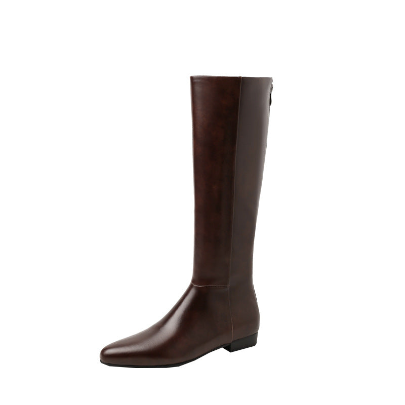 Single brown knee-high leather boot with pointed toe and hidden heel
