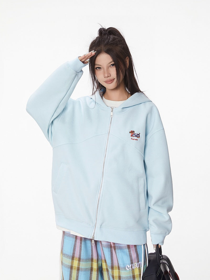 Light blue hooded zip-up jacket with dachshund chest embroidery, front view