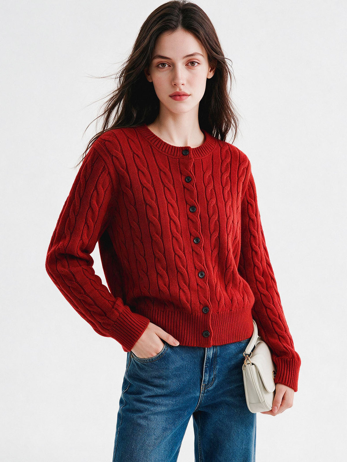 Women’s red twist-knit cardigan with round neck and button-front, long sleeves, cable pattern