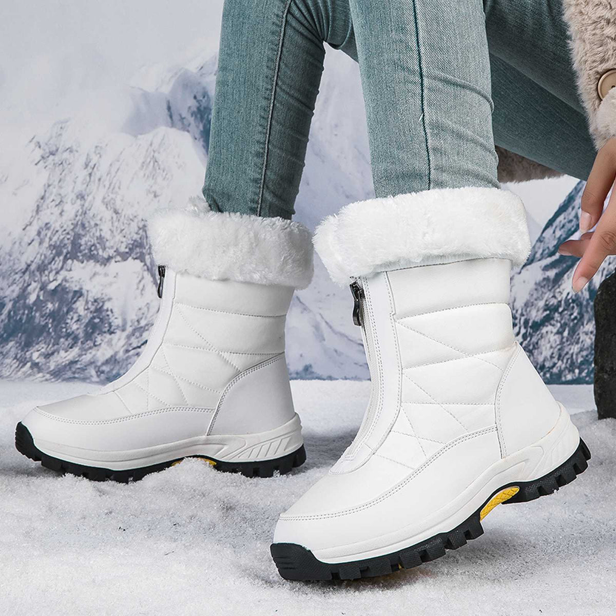 Women's white mid-calf snow boots, faux-fur cuffs, quilted uppers, side zip.