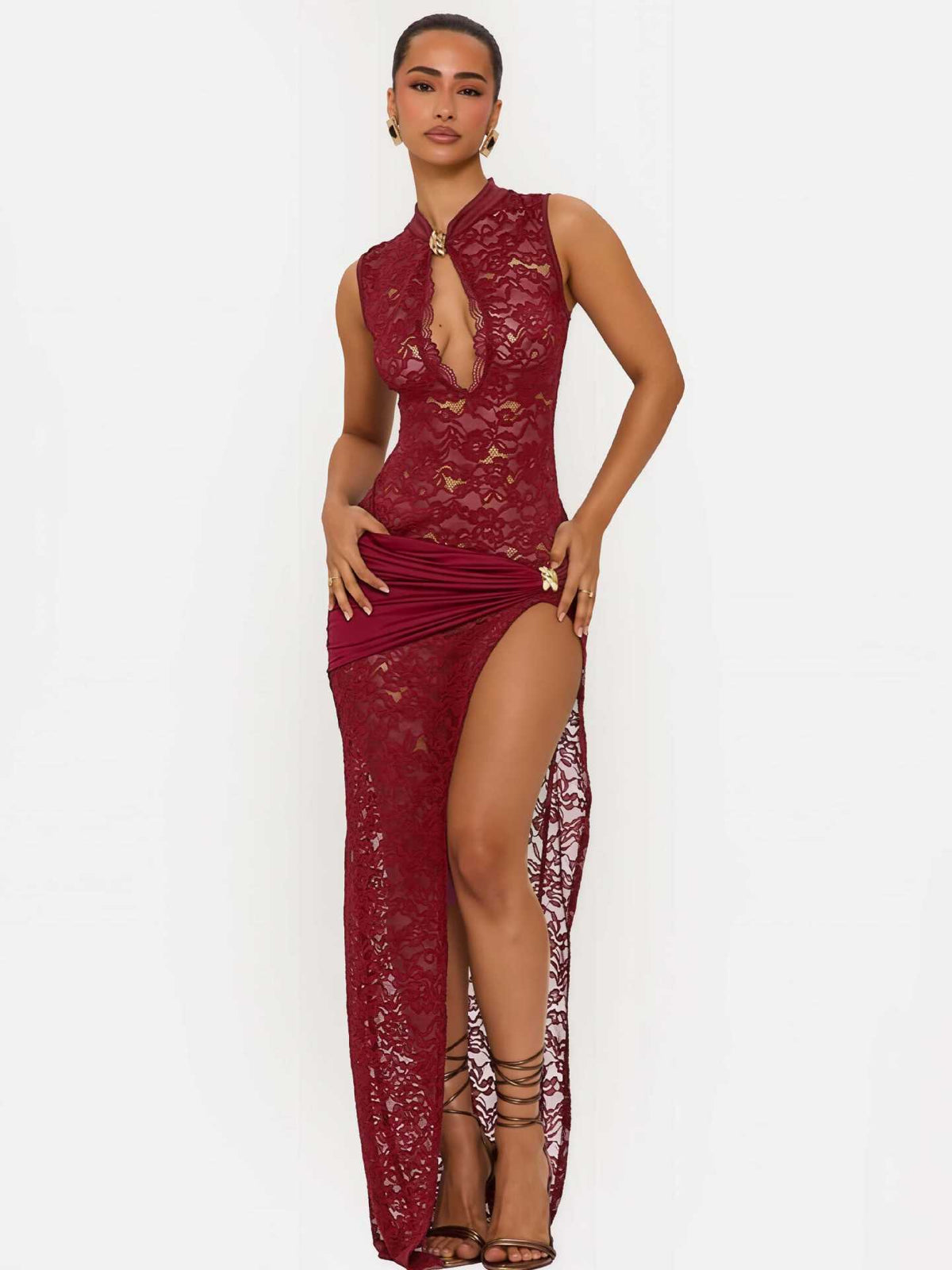 Red lace long dress with sleeveless high neckline and ruched draped front slit.