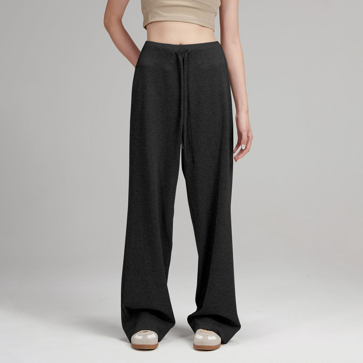 Black knit lounge pants with drawstring waistband and relaxed wide legs
