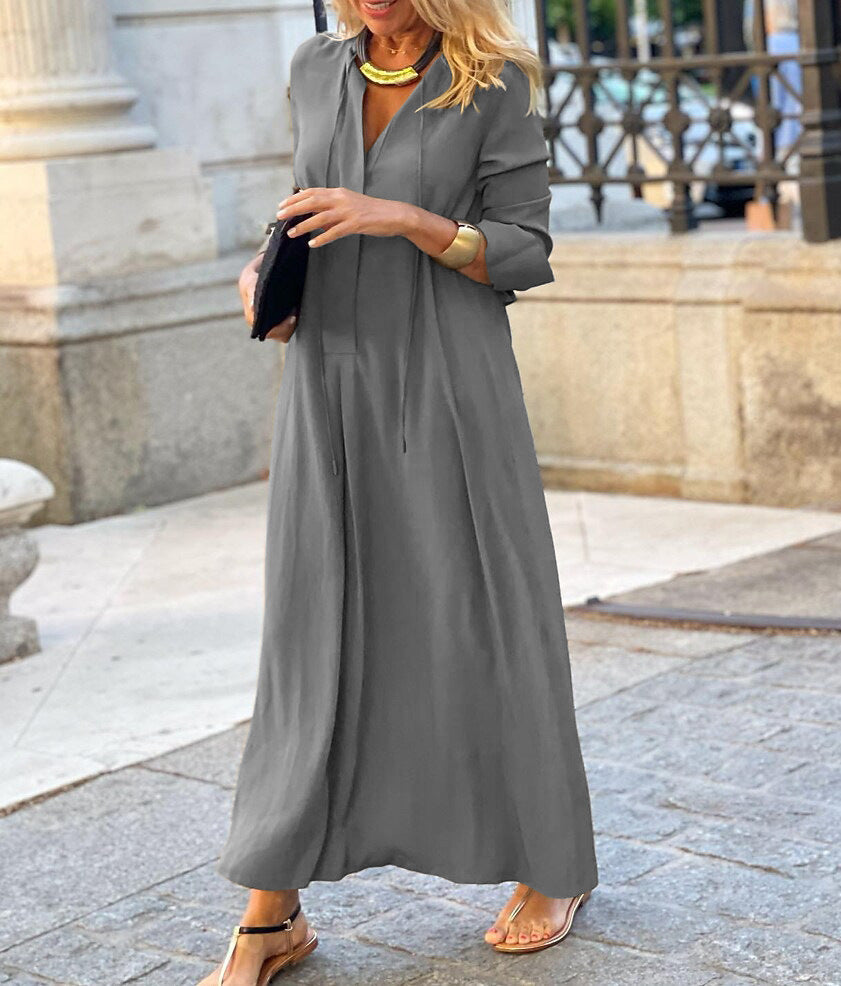 Gray linen maxi dress with long sleeves, V-neck, cinched waist and flared skirt