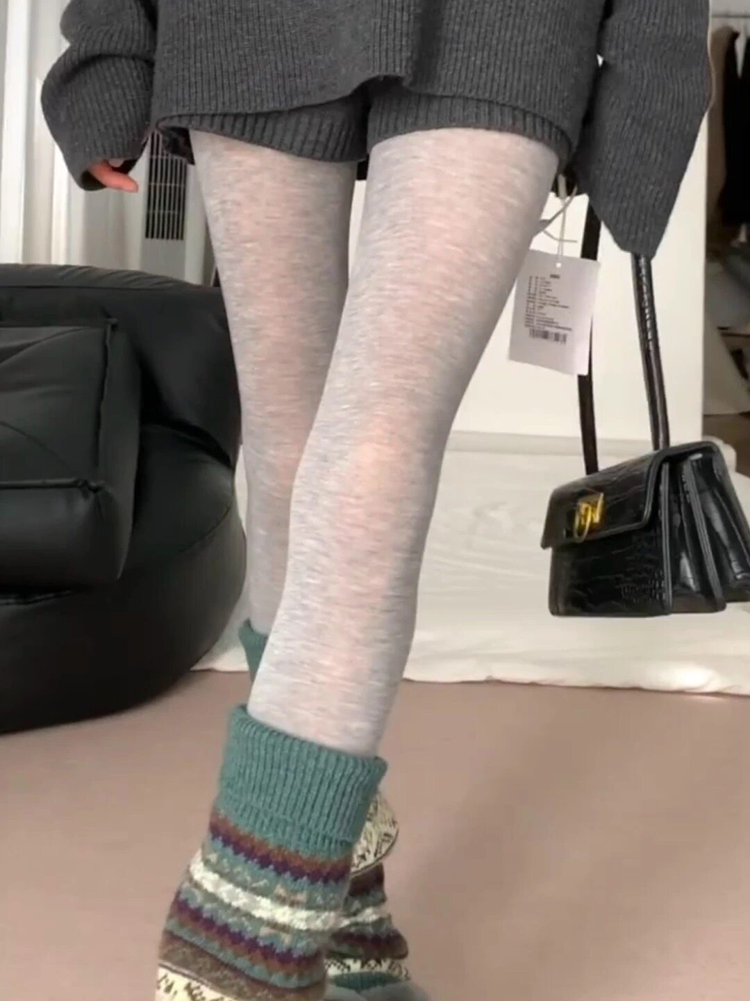 Matte sheer light gray pantyhose with smooth texture and fitted long-leg coverage