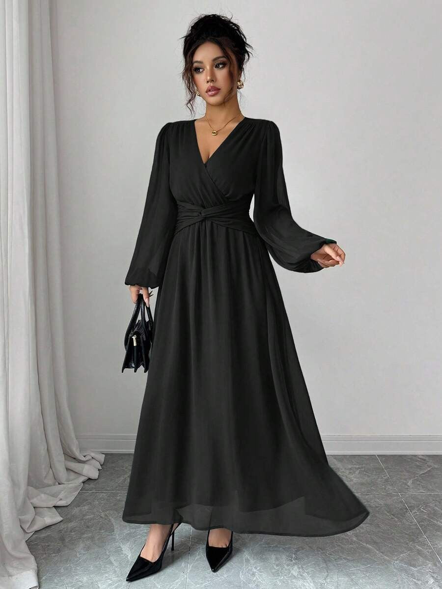 Black chiffon maxi dress with long sleeves, wrap front, cinched waist.