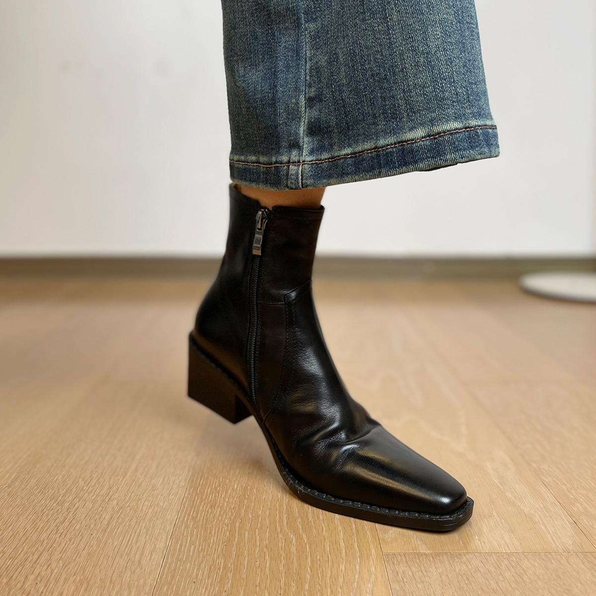 Women's black leather ankle boots with square toe and block heel, back zip detail