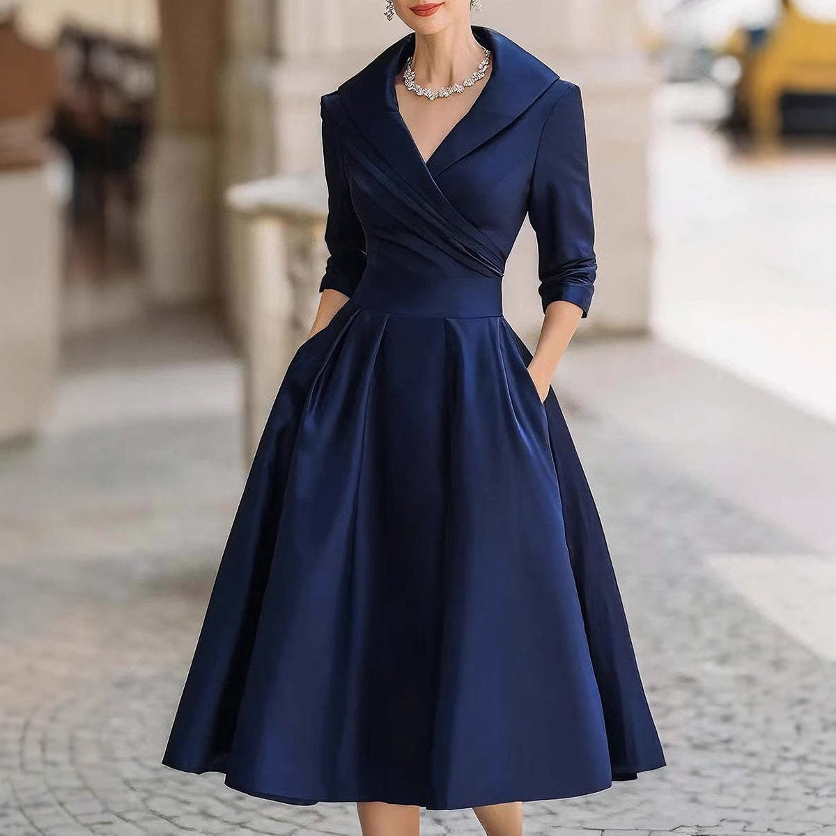 Women’s waist-cinching dress, dark blue, long sleeves, V-neck, A-line skirt.
