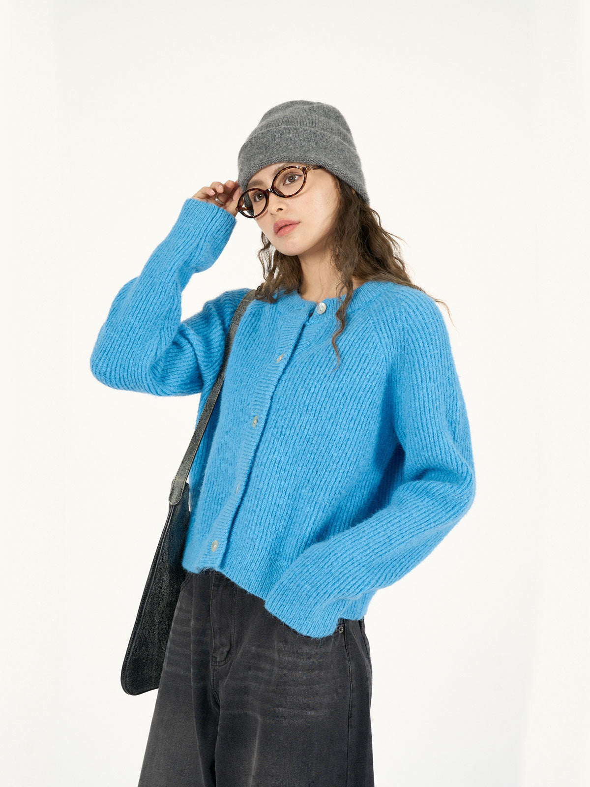 Blue women's knitted cardigan with round neck, long sleeves and button front