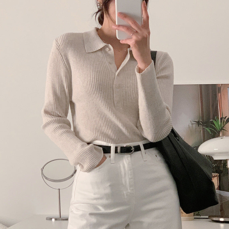 White knit polo collar long-sleeve top, button placket and textured ribbed knit front.