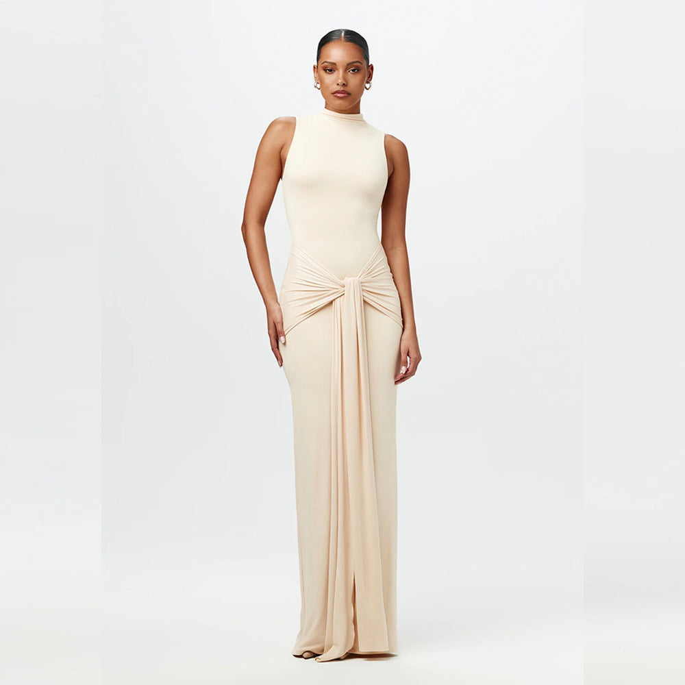 Cream sleeveless maxi dress with mock neck and ruched waist tie