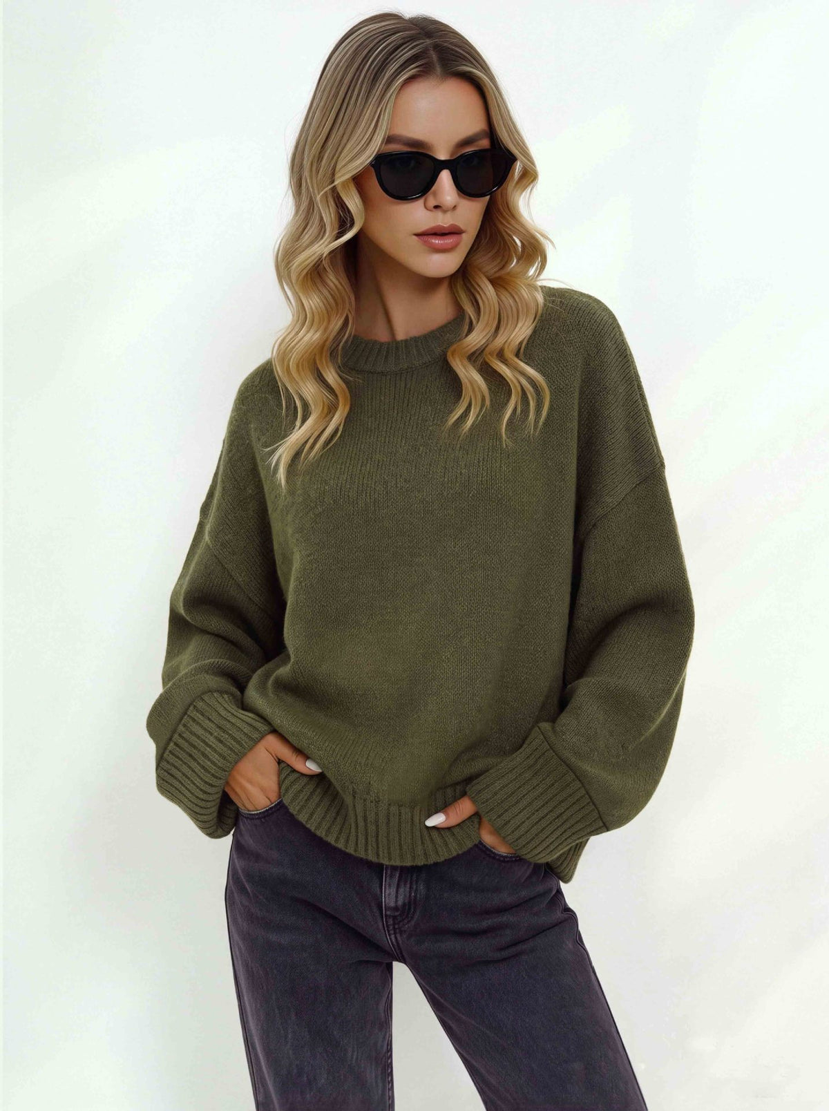Women's loose military green knit sweater with a crew neck and ribbed cuffs and hem
