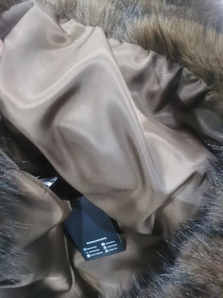 Off-white faux fur hooded pullover top with hood lining detail and tag