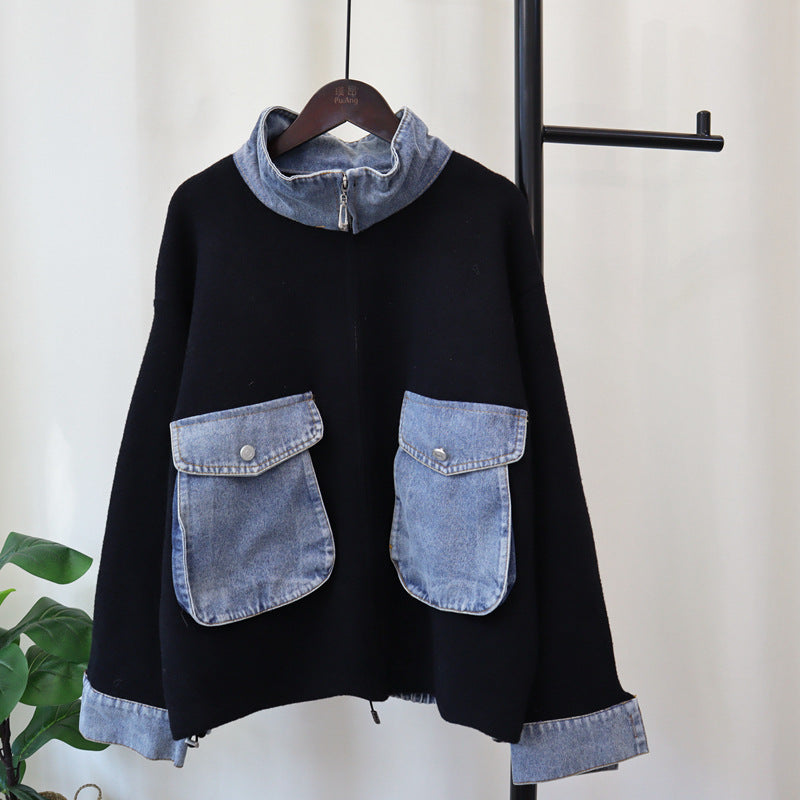 Black zip-front knitted cardigan with light blue denim patch pockets and ribbed cuffs
