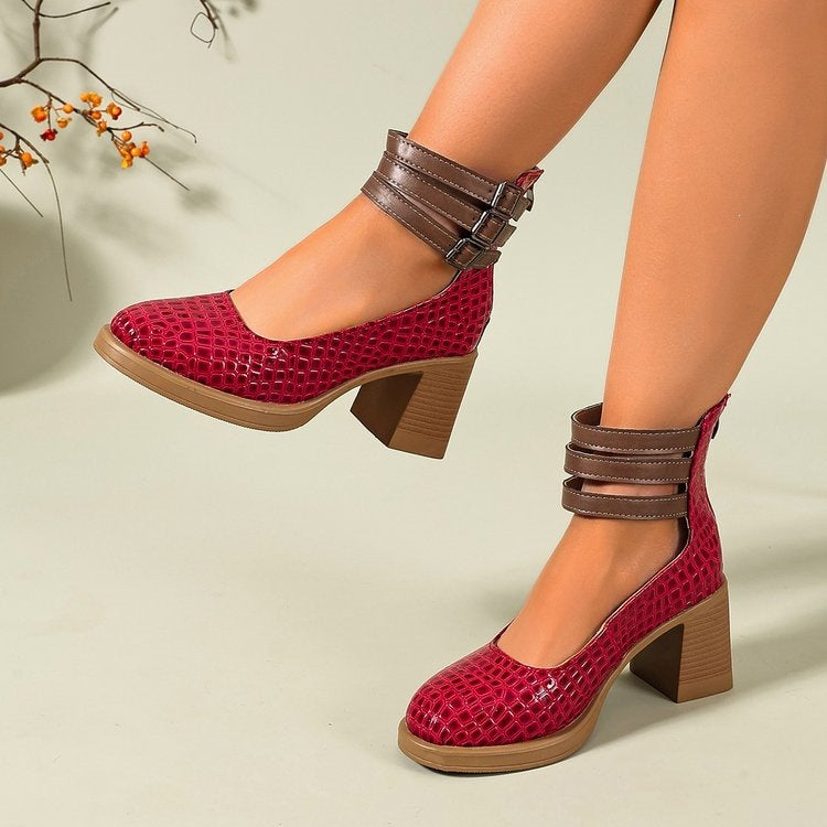 Burgundy Mary Jane style platform pumps with textured finish and buckle ankle strap