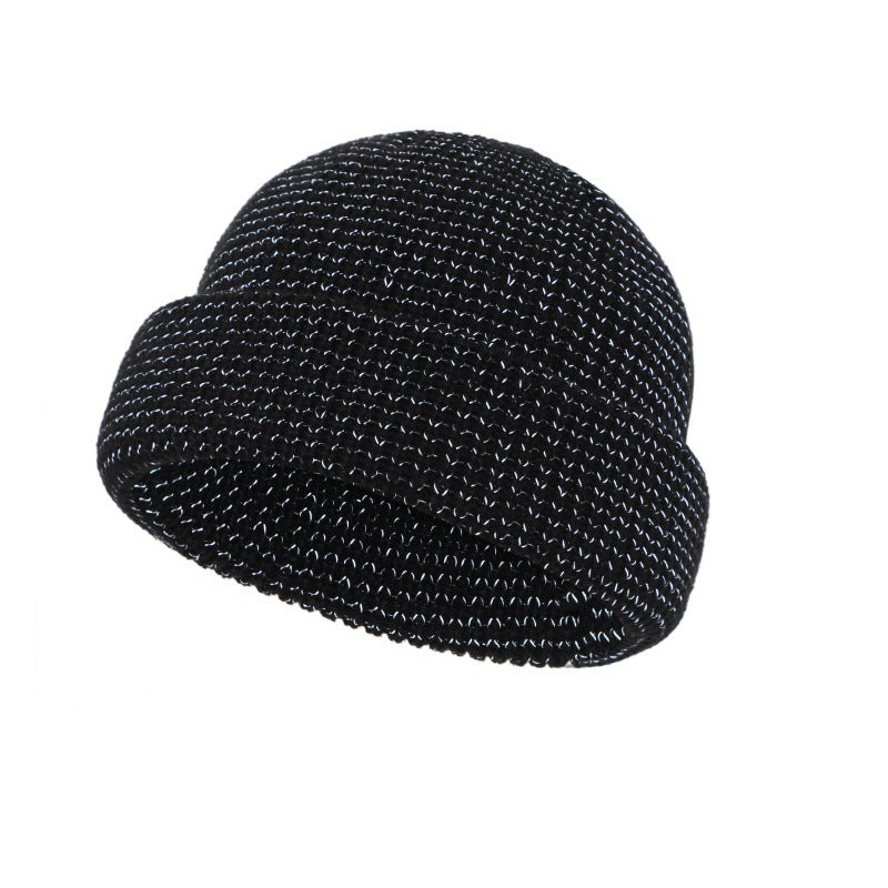 Black knitted beanie hat with folded cuff, textured stitch knit