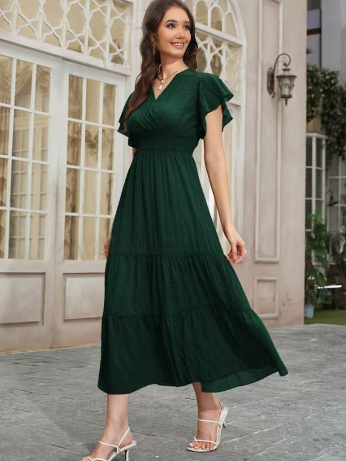 Dark green V-neck tiered midi dress with short puff sleeves and cinched waist