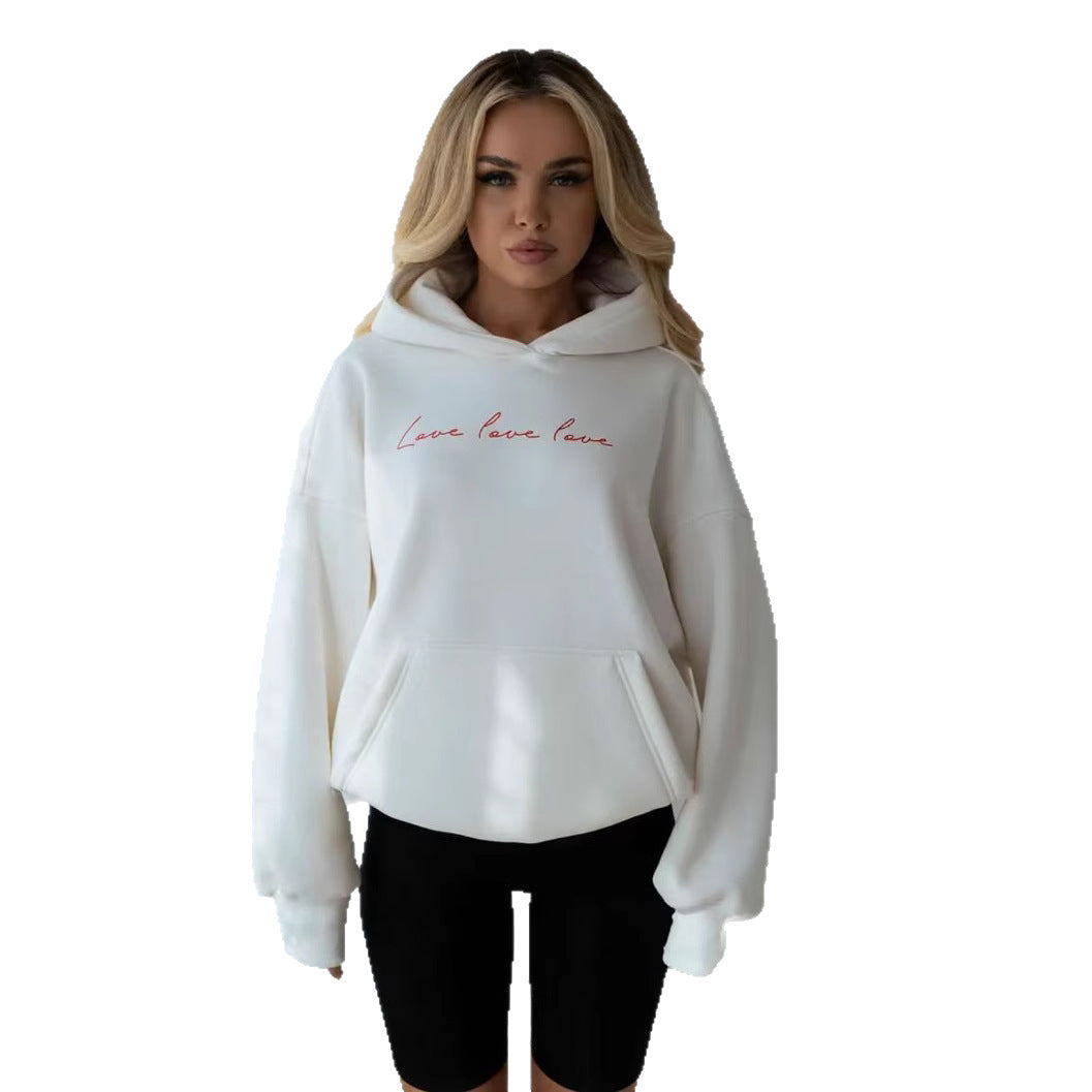 White hooded pullover with red script "Love love love" and front kangaroo pocket