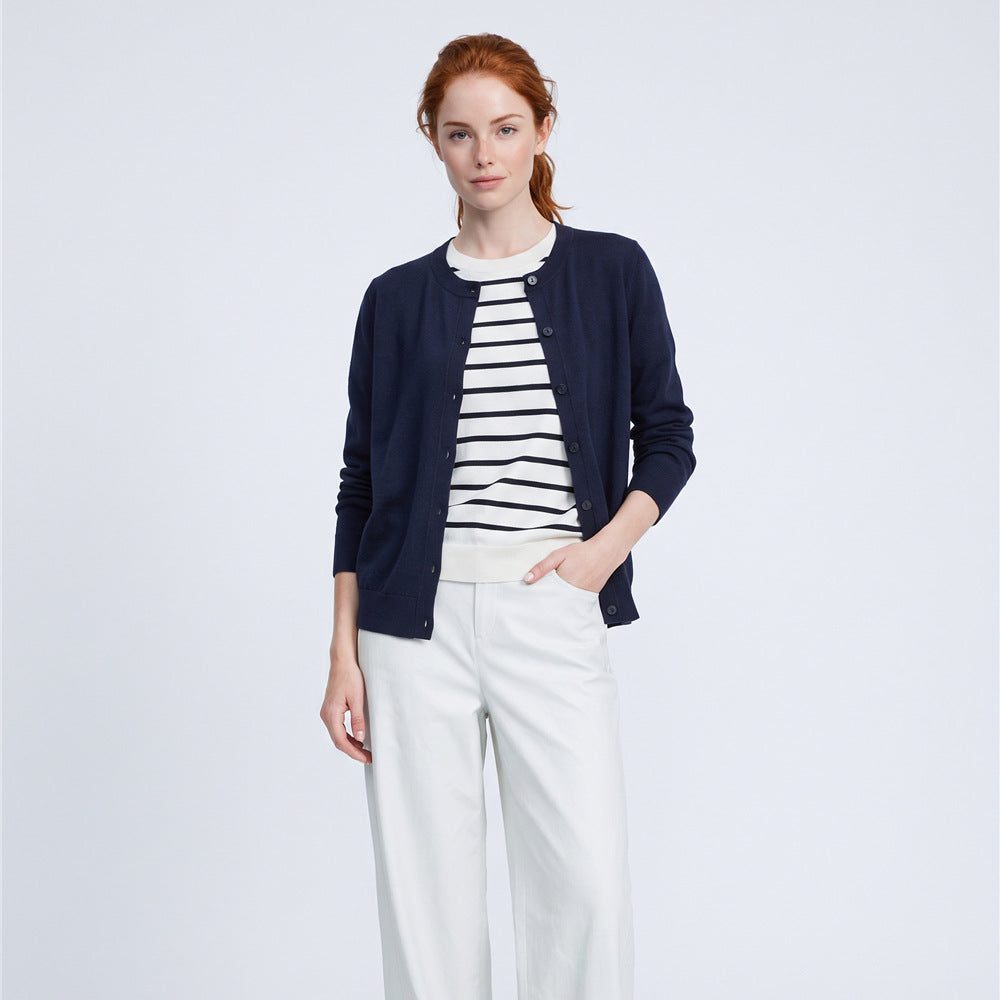 Women’s navy button-front cardigan sweater with faux striped tee underlayer